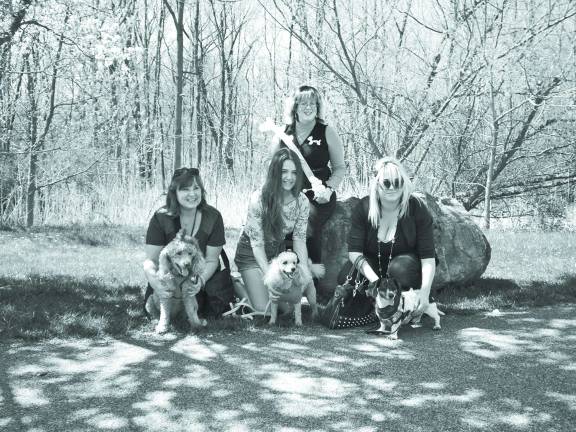 First place in center, Indai and Gingersnap, second place on left Elyse of New Milford with her apricot poodle Dakota and third place on right is Alyson Capara of Green Township with Reny. In the back is Pinky the Clown.