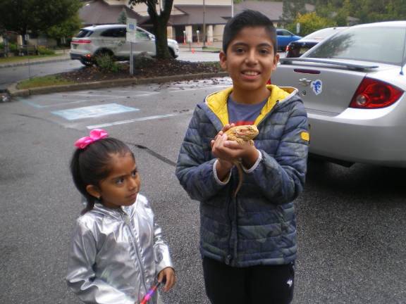 Jacqueline and Joshua Rios need to get Charsizarz, a bearded dragon, back home and under his heat lamp after his blessing.