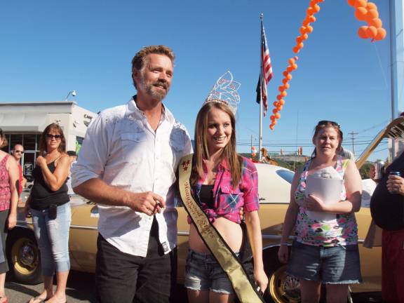 Sixteen year old Marissa Avino of Vernon poses with actor John Schneider.