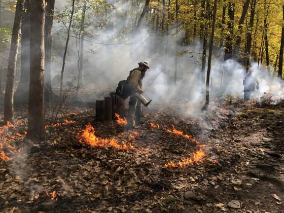 Diesel fuel is used to start the fire. (Photo by Kathy Shwiff)