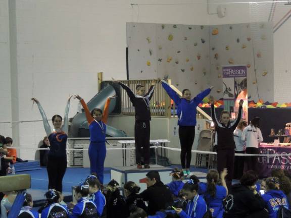 Emily Rodriguez, of Stillwater, and Morgyn Witt, of Newton, take third and fifth place on the Balance Beam.