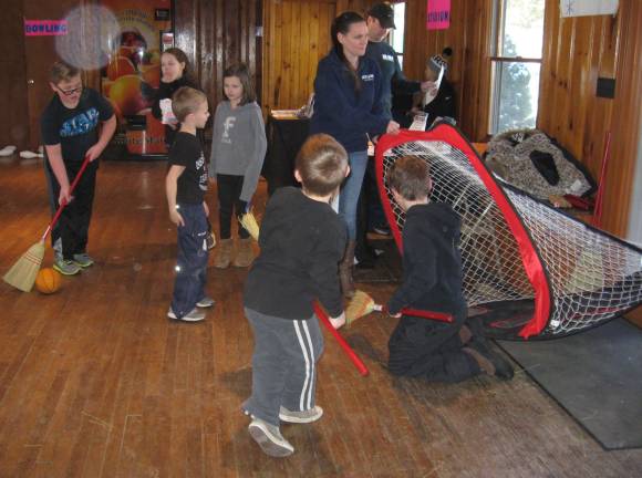 Broom hockey is popular at the winter carnival.