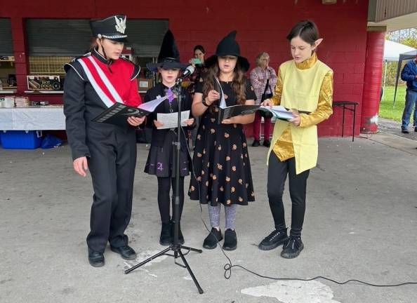 Members of 4-H Rhapsody in Color, a music and fine arts club, perform at Sussex Day.