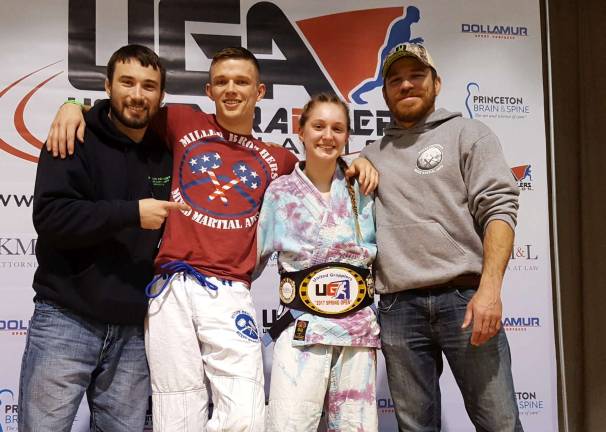Jim Fitzpatrick, Bobby Ingram, Brooke Fahey and Jim Miller celebrate Fahey's victory in a Brazilian Jiu-Jitsu superfight