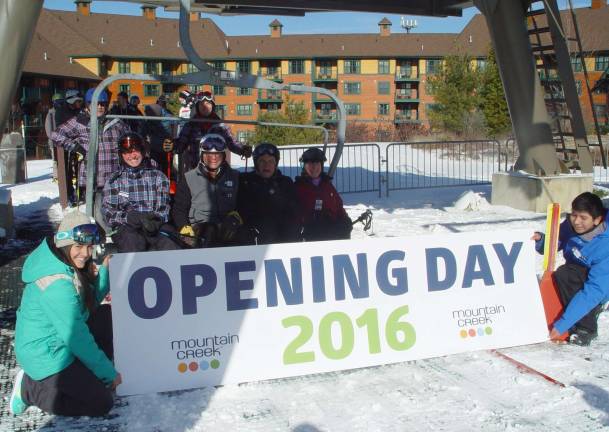 Mountain Creek&#xfe;&#xc4;&#xf4; s Wacky Jackie holds opening day sign with Daniel Bryson, David Blinken, John Whiting and Buffy Whiting given the honor of riding the 1st chair of the 50th Anniversary Season