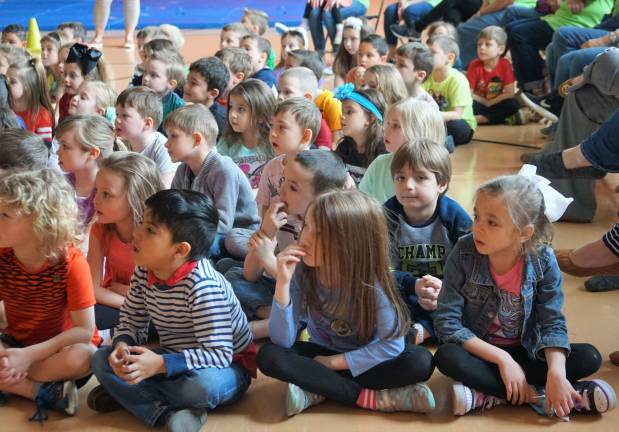 The Cedar Mountain Kindergarten class listens attentively.