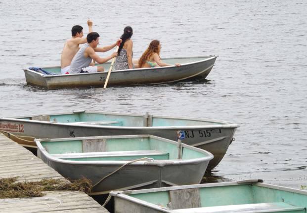 Photo by Chris Wyman A group of people row away from the dock on Wawayanda Lake in Wawayanda State Park.