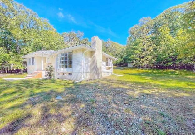 Updated four-bedroom country ranch on nearly three acres