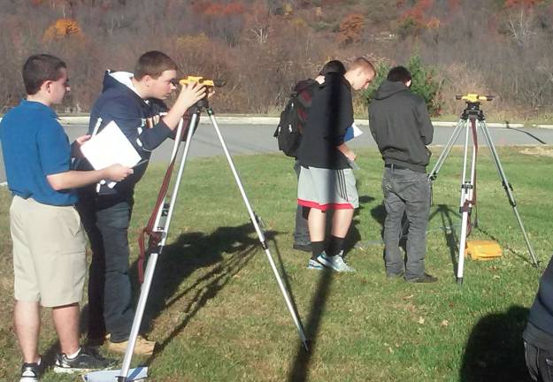 Students in Jon BrunoþÄôs Civil Engineering course at Vernon Township High School use their survey equipment to do point elevations on the schoolþÄôs scenic grounds. The class is part of the STEM program at the high school which teaches students using industry grade programs and equipment.