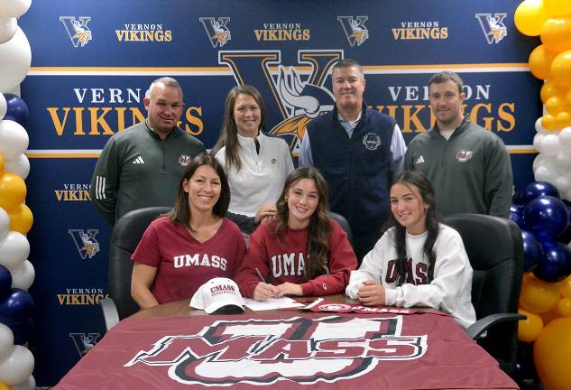 <b>Vernon Township High School senior is shown with, standing, from left, her father, girls’ soccer coach Casey Jacoby, Athletic Director Bill Foley, Athletic Trainer Matt McKowen; her mother, and sister Vanesa are seated.</b>