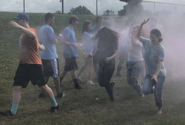 Runners got blasted with color as they reach the finish line.