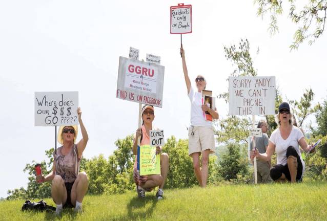 PHOTO BY BOB BREESE Protesters are shown outside Great Gorge Village on Sunday in Vernon Township.