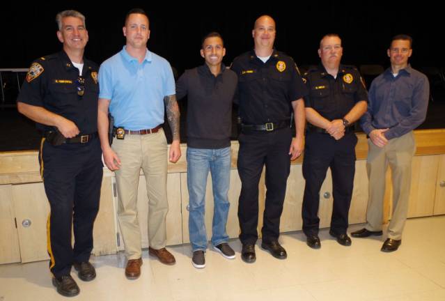 Mathew Maher (third from left) is shown with several of the police officers who attended the special program.