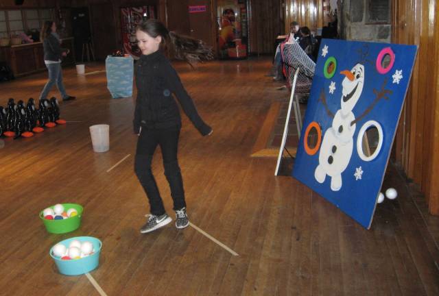 The snowball toss required skill at the winter carnival in Highland Lakes.