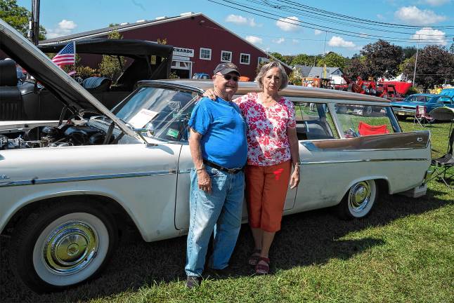 <b>John and Pat Kapral with a 1957 Suburban.</b>