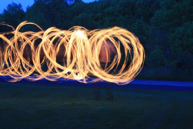 Jon Larsen, fire spinning/ fire poi