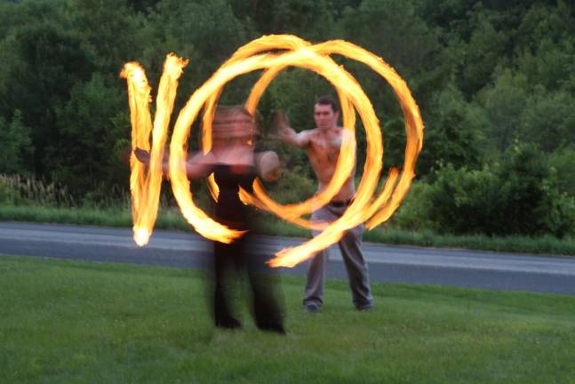 Jon and Eleanor Larsen demonstrate Fire Poi.