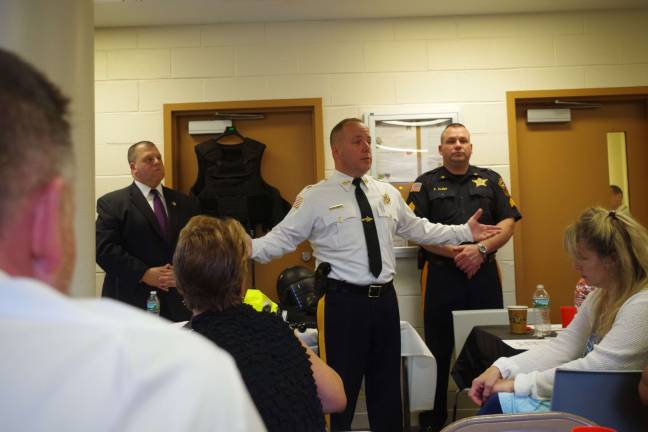 Sussex County Sheriff Mike Strada speaks about the assortment of correctional facility tools on the table behind him.
