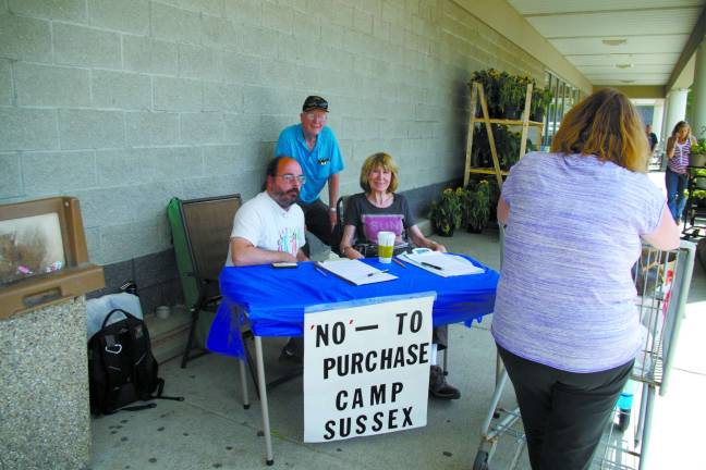 Photo by Chris Wyman Local residents aiming to quash the potential Vernon Township Council&#x2019;s purchase of Camp Sussex were collecting signatures at the A&amp;P supermarket on June 28. From the left are Steve Vichiconti, petitioner Robert Gerry, and Gerry&#x2019;s wife Christa.