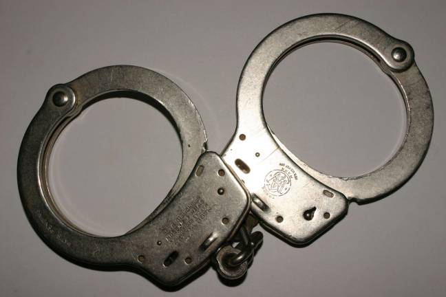 Two charged in gas station robbery