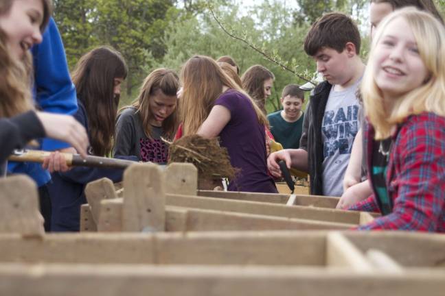 Students from Glen Meadow Middle School work the sifters looking for artifacts at Black Creek Site in Vernon.