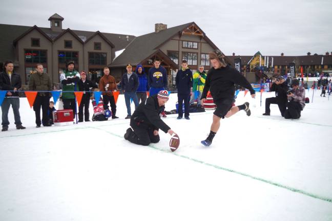 Owen Pullis, 18, is shown making the winning kick that won a 120 to 125-person pig roast to benefit the Vernon PAL. The prize was courtesy of Smokin&#xed; Steve&#xed;s BBQ and the Yetter's Diner of Montague.