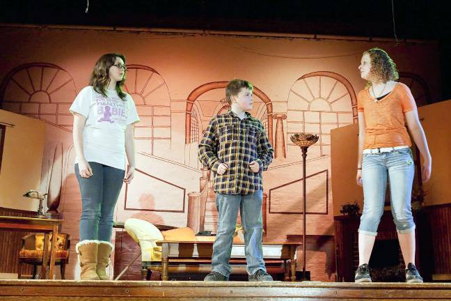 Pictured from left: Jessica Poggi as Grace, Evan Poust as Oliver Warbucks and Emily Seely as Annie.