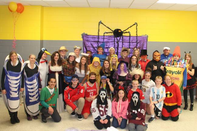 The Vernon Township High School DECA chapter sponsored a Costume Dance for the Life Skills students, filling the Autumn season with delightful laughter. The party consisted of the students partaking in several different activities like pumpkin painting, karaoke, and dancing. The event was made possible by the generosity of Pizza Pros of McAfee, Heaven Hill Farm of Vernon, NJ, and Wallkill Group of Hamburg.