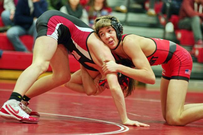 High Point's Brandon LaRue looks up at the time clock as he holds down Westwood's Ty Pfeufer in the 113 lbs match
