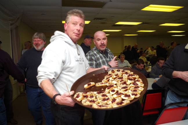 Dave Festa of Barry Lakes passes around a platter of black bear stromboli topped with cranberry sauce.
