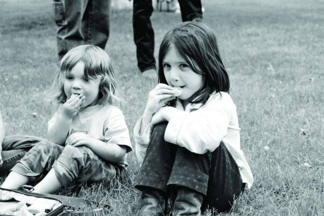 Photos by Gale Miko Madeline and Asher Norwood-Orsi of Wantage take a break at the Medicine Wheel ceremony.