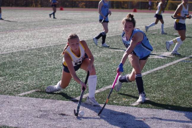 Vernon midfielder Abigail Cawley drives the ball as Sparta midfielder Ava Capeci reaches in with her stick. Cawley scored one goal.