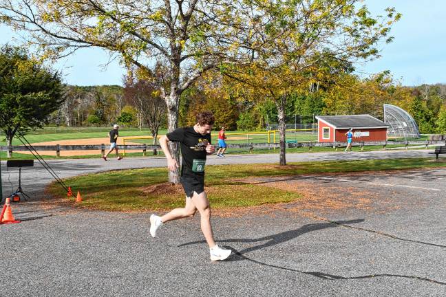 <b>John Russo of Milford, Pa., wins the 5K Family Run/Walk.</b>