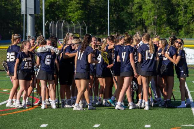 VLX4 Vernon teammates join in a group hug after their loss to Sparta in the first round of the girls varsity lacrosse state tournament.