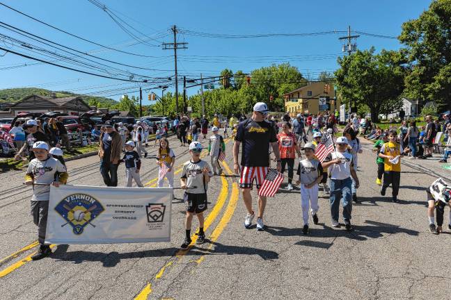 <b>Vernon Little League players march in the parade.</b>