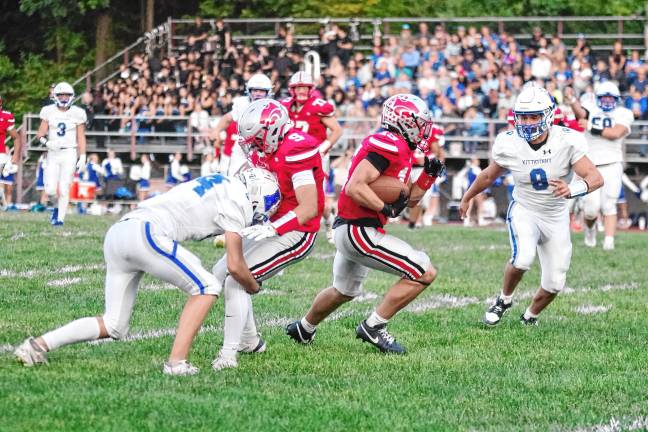 <b>High Point ball carrier Jerron Martress finds an opening in the game against Kittatinny on Friday, Sept. 12. He scored twice and rushed for 143 yards. The Wildcats won, 14-7. (Photos by George Leroy Hunter)</b>