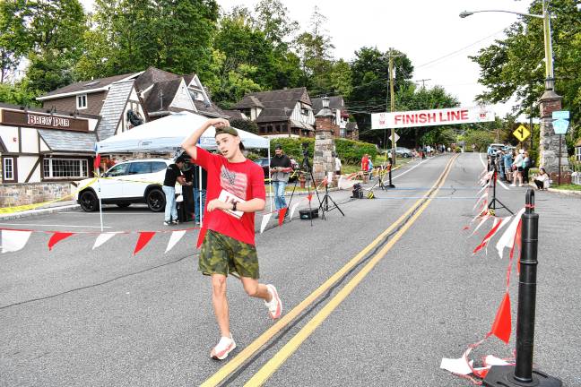 Jack McGurrin, 17, of Sparta wins the Labor Day 5K with a time of 17:04.29.