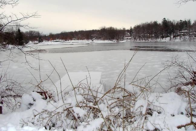The beauty of the ice covered lake in Highland Lakes contrasts the strength and velocity of last week's snowstorm that dumped over a foot of snow.