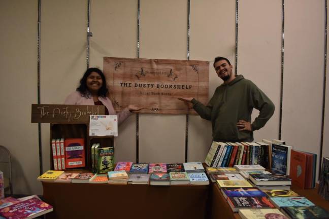 Veronica and A.J. Siehin operating a pop-up bookshop at the Newburgh Mall Holiday Market on Saturday, Nov. 19.