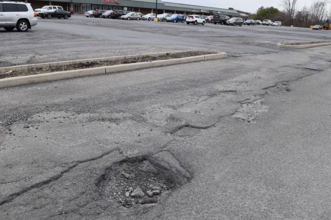 Do you have a pothole that needs to be fixed in your community? The Goshen Plaza parking lot in Goshen, N.Y. has been full of potholes for years.