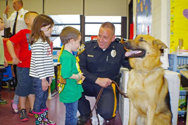 Photo by Chris Wyman Walnut Ridge preschool children had a chance to meet K9 Officer Cpl. William Gebhard and Police Dog Hobbs &#xec;up close and personal.&#xee; The police dog is a 1-1/2-year-old male German Shepard and weighs about 95 pounds. The dog&#xed;s primary job is to find missing people.