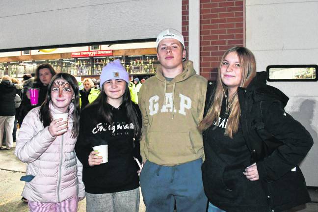 <b>Morgan McCAbe, Ella Raperto, Nick Carter and Taylor Raperto pose at the tree lighting.</b>