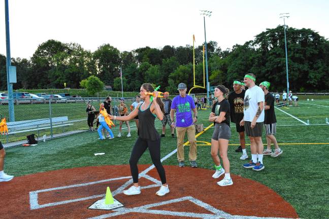 <b>Participants throw rubber chickens at targets.</b>