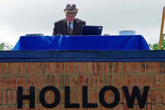 PHOTO BY CHRIS WYMAN Wantage resident Rich Winstock, who is the owner of Sky Dive Sussex, started the Car, Truck and Bike Show with a dramatic entrance with a large American flag hanging from his waist. He was the last of ten skydivers to arrive at Woodbourne Veterans Memorial Park on Oct. 11.