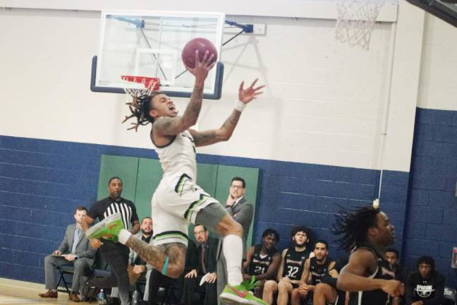 Philip Ross of Sussex County Community College (SCCC) goes airborne during the game against Northampton Community College on Saturday, Jan. 13. He scored 23 points, and the Skylanders won, 72-65. (Photos by George Leroy Hunter)