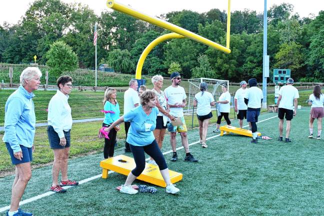 <b>The competition, organized by the township’s Recreation Department, included cornhole.</b>