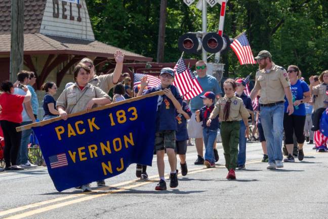 Cub Scouts Pack 183 of Vernon marches in the parade.