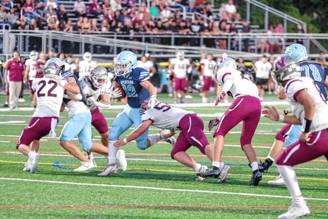 <b>SN1 Sparta ball carrier Brady Shagawat on the run in the first half of the game against Newton on Friday, Sept. 19. He made three touchdowns and rushed for 96 yards. The Spartans won, 35-20. (Photos by George Leroy Hunter)</b>