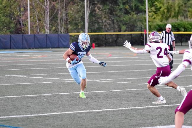 <b>Sparta ball carrier Christian Brevig runs.</b>