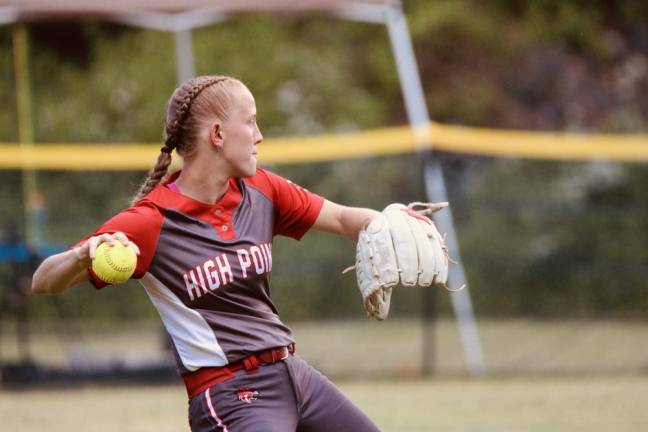 HP4 Left fielder Rachel Teague, a junior, prepares to throw the ball.